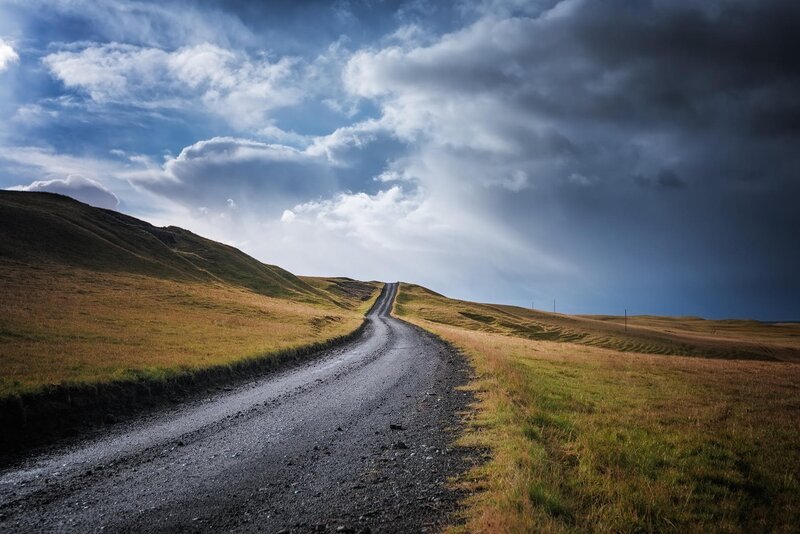 Gravel Road Through Hills — Blue