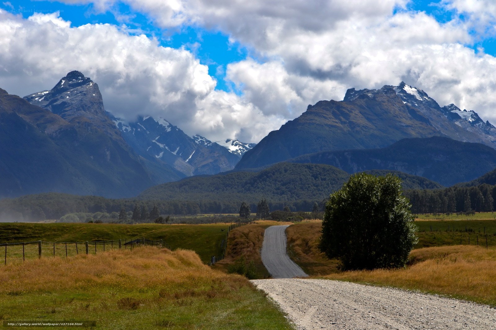 Gravel road through mountain valley