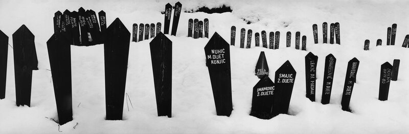 Graves in a snowy cemetery