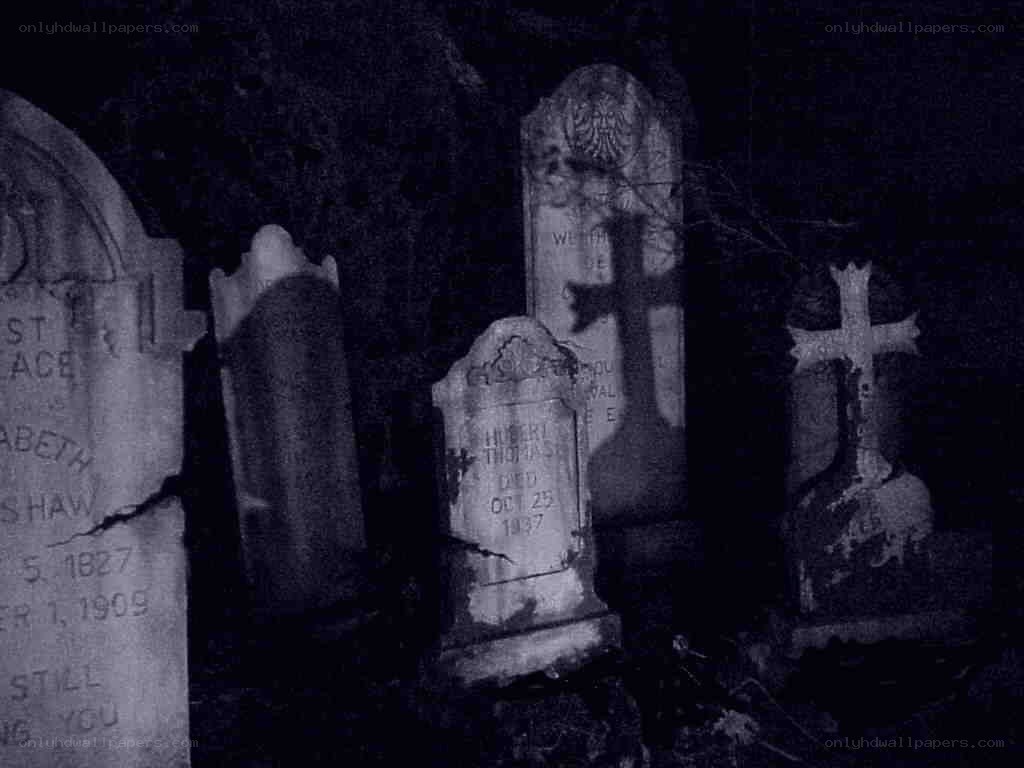 Gravestones in a dark cemetery