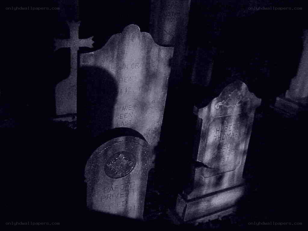 Gravestones in a dark cemetery