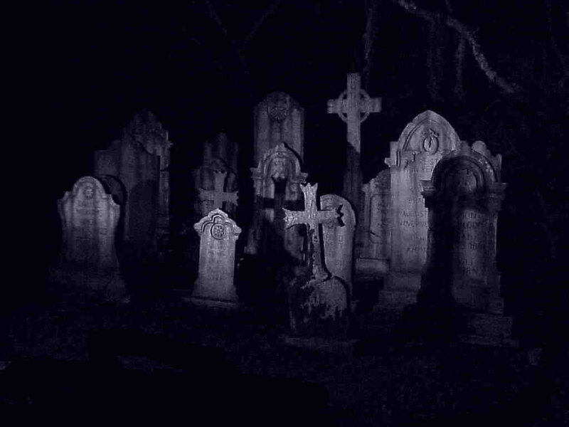 Gravestones in a dark cemetery