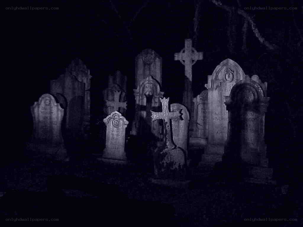 Gravestones in a dark cemetery