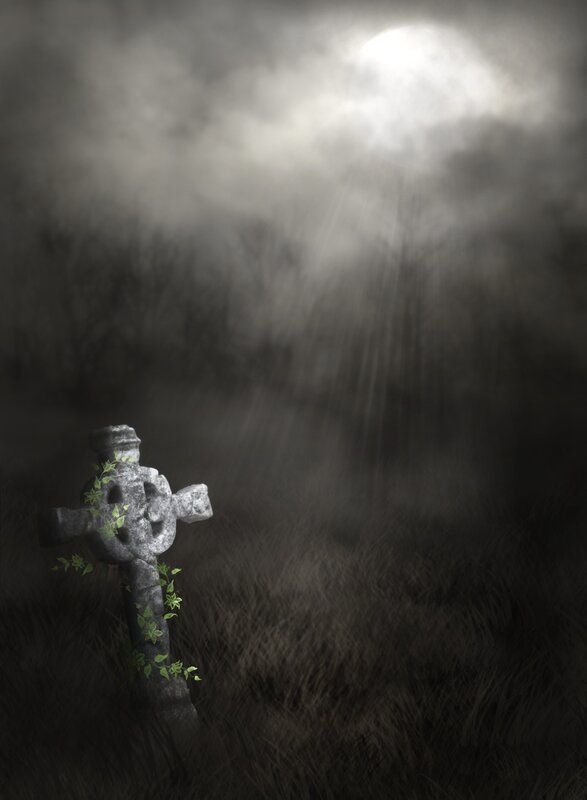Graveyard cross in mist