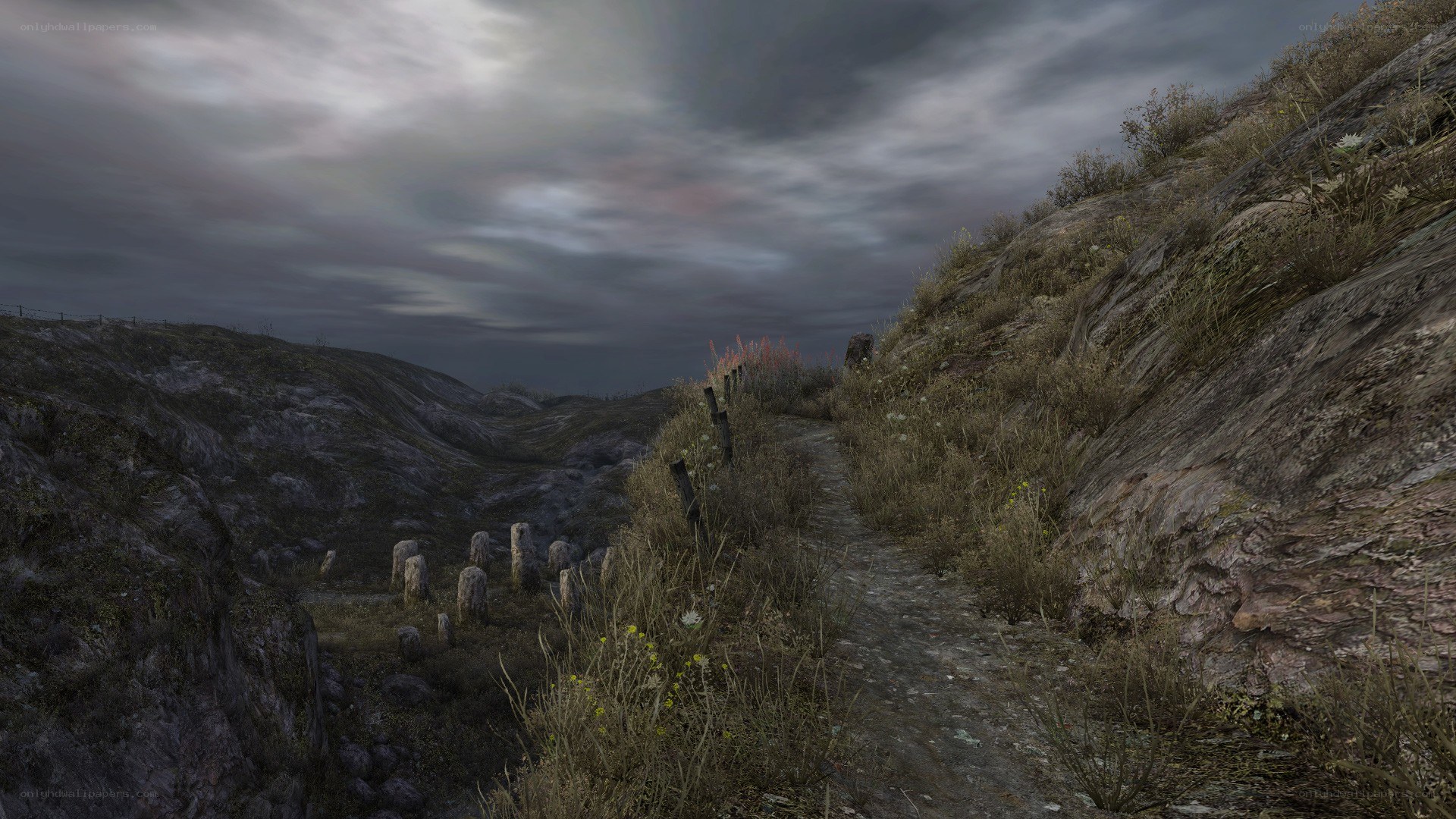 Graveyard path in rocky hills