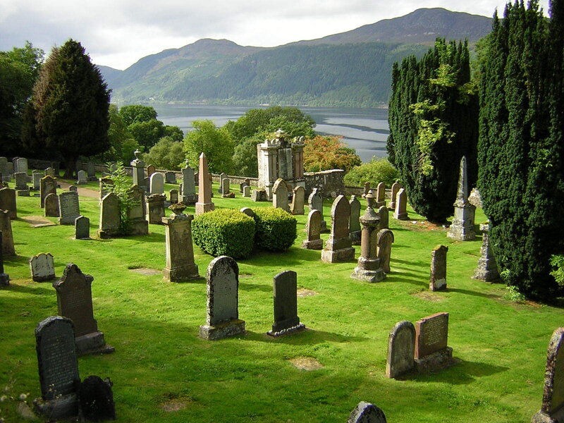 Graveyard with lake and mountains