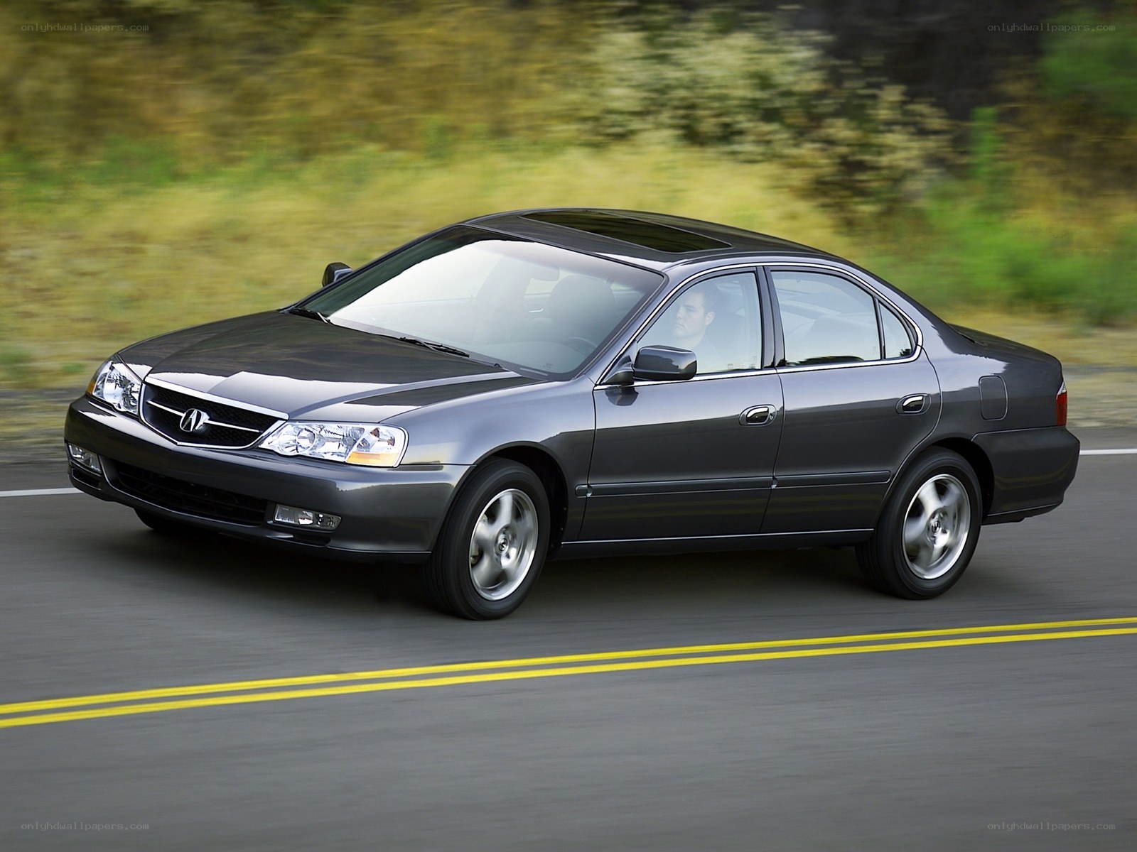 Gray Acura TL in motion