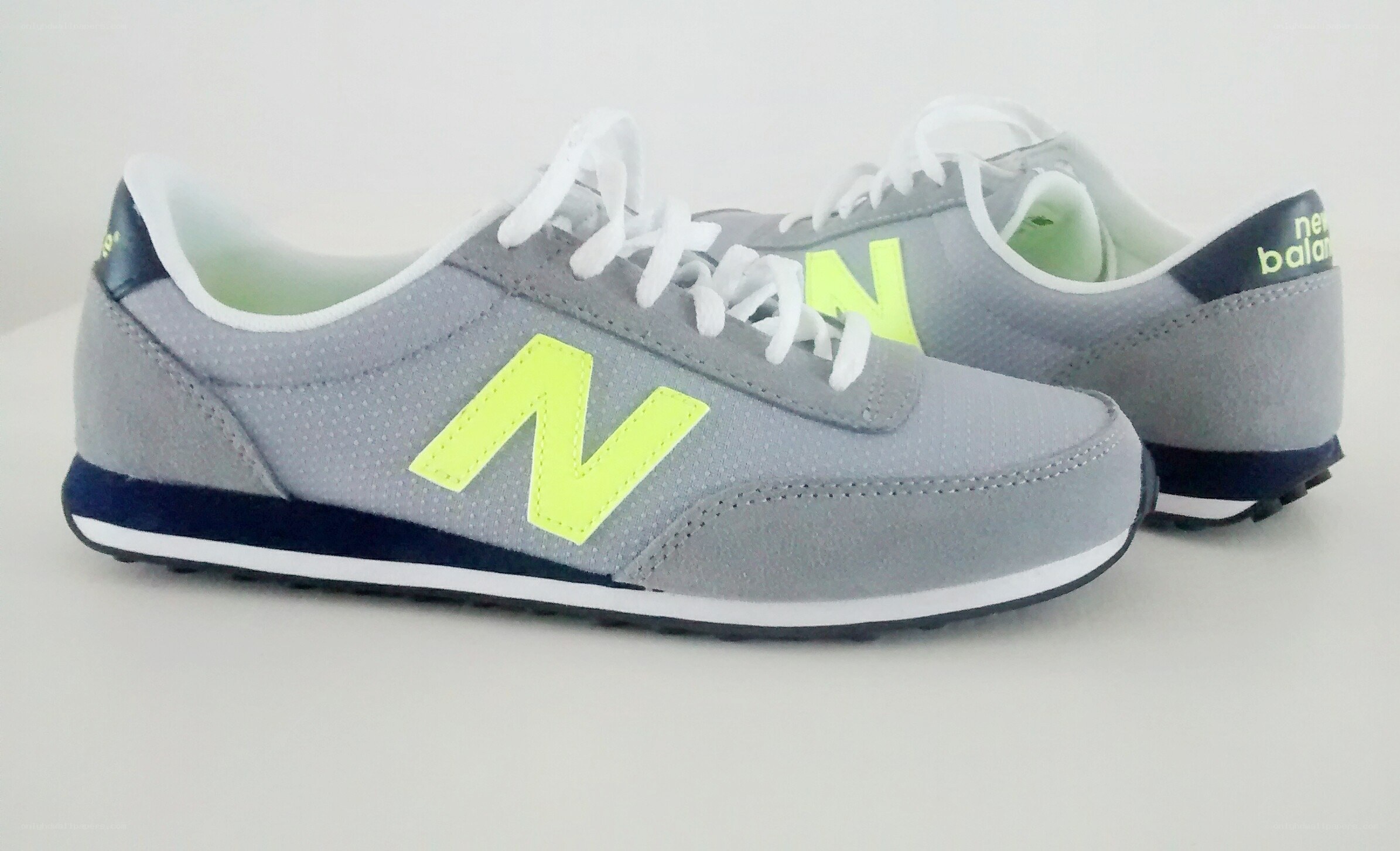 gray and neon yellow sneakers