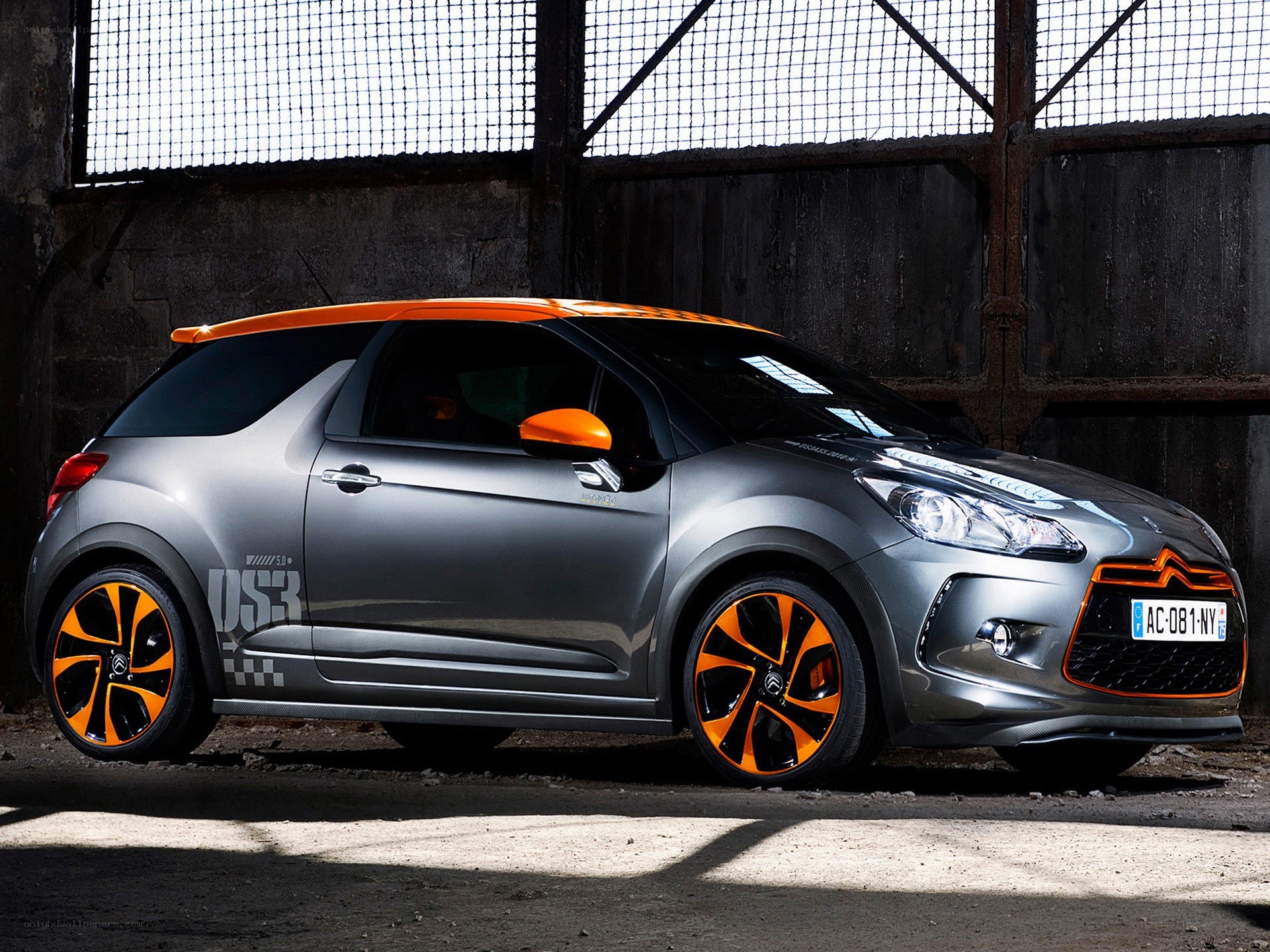 gray and orange car in garage