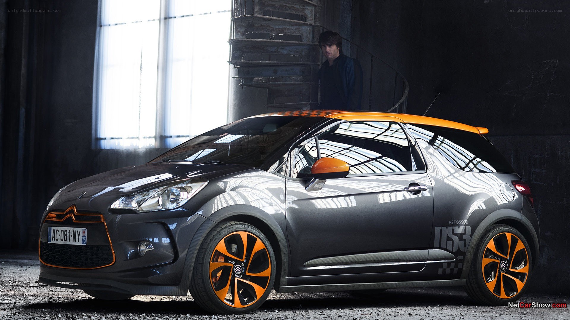 gray and orange car in warehouse