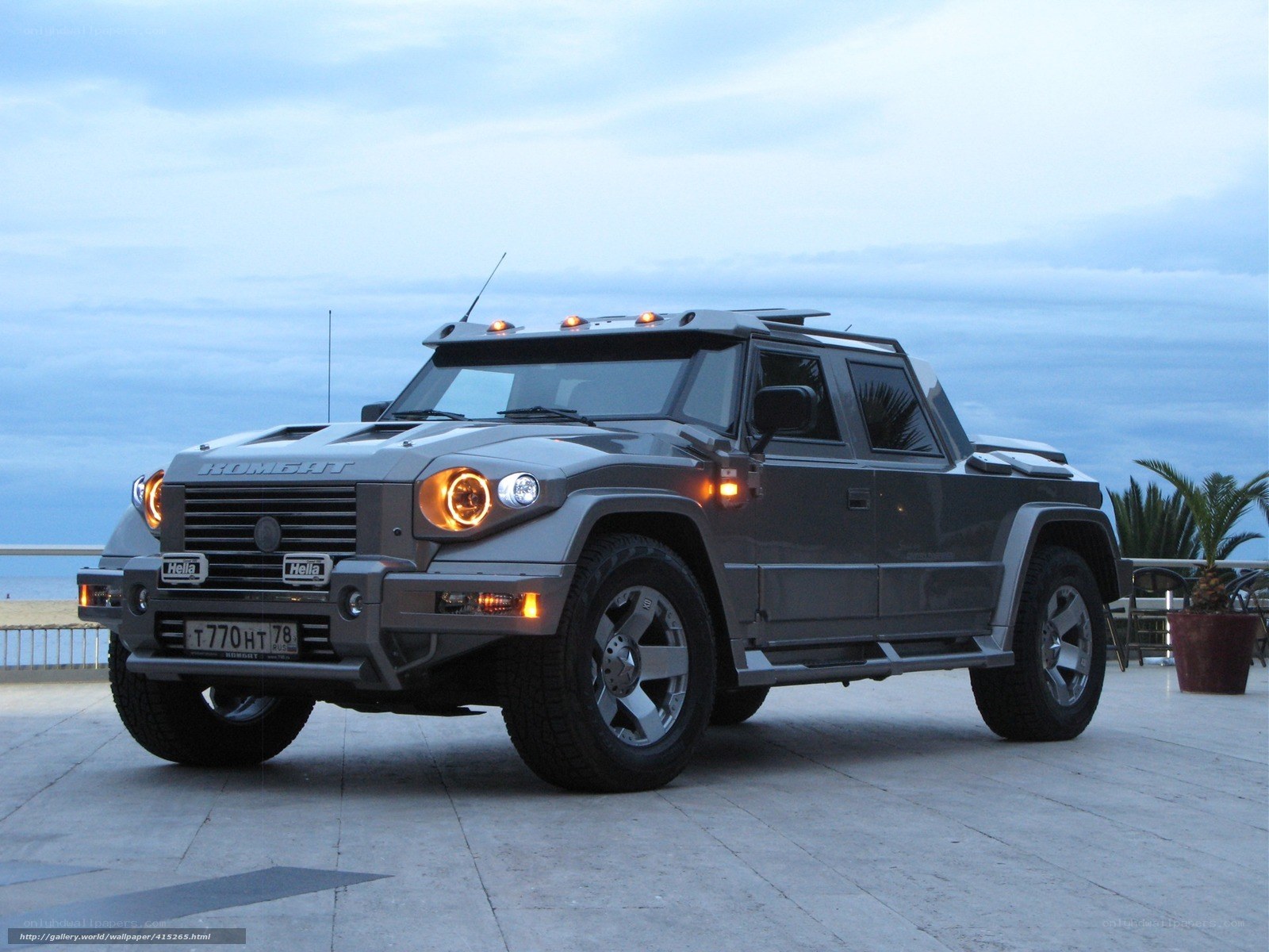 gray armored truck by the sea