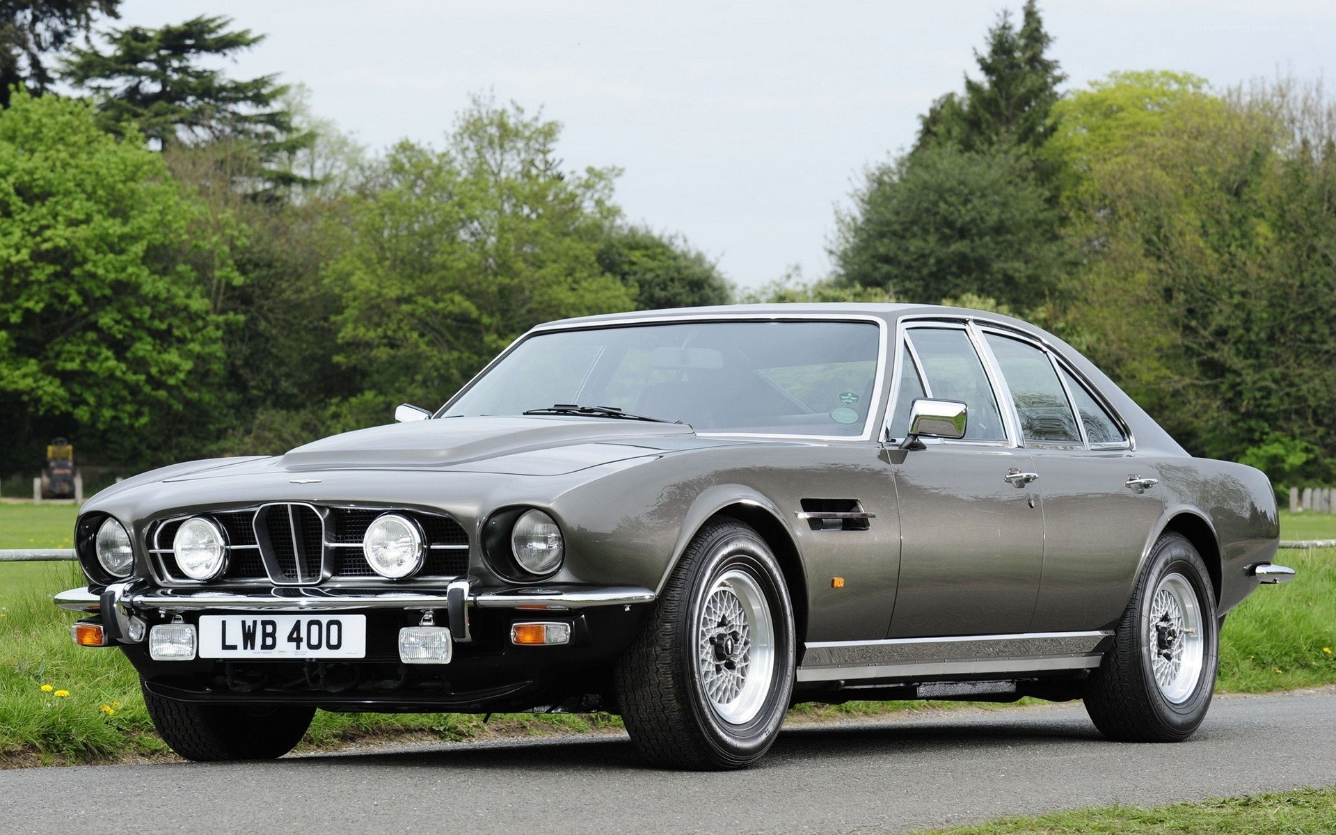 gray aston martin on road