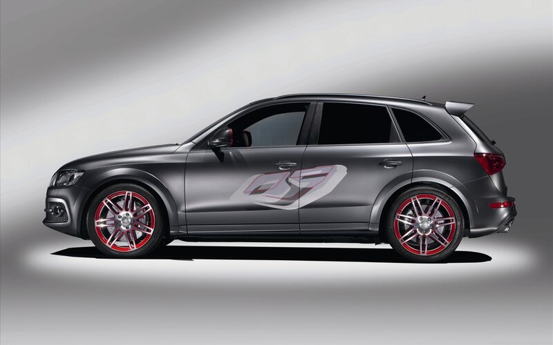 gray audi suv with red wheels