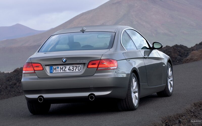 gray bmw 335i on mountain road