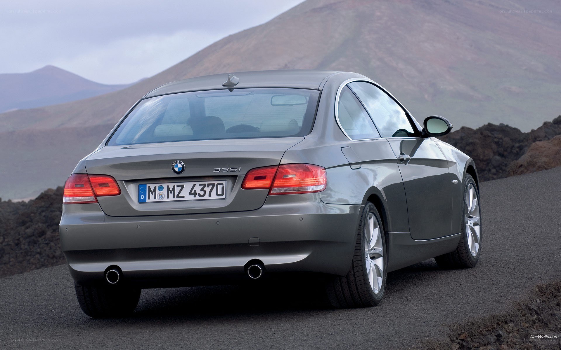 gray bmw 335i on mountain road