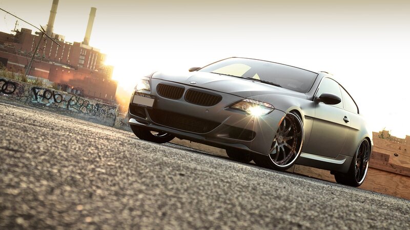 gray bmw coupe at sunset