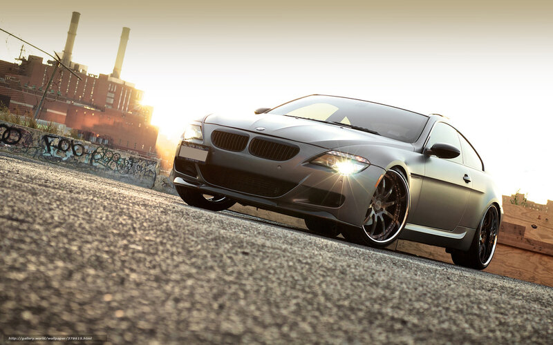 gray bmw coupe at sunset