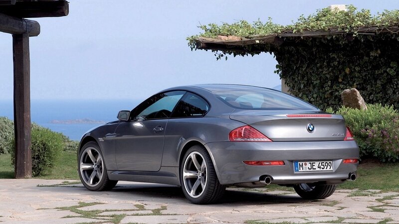 Gray BMW coupe by the sea