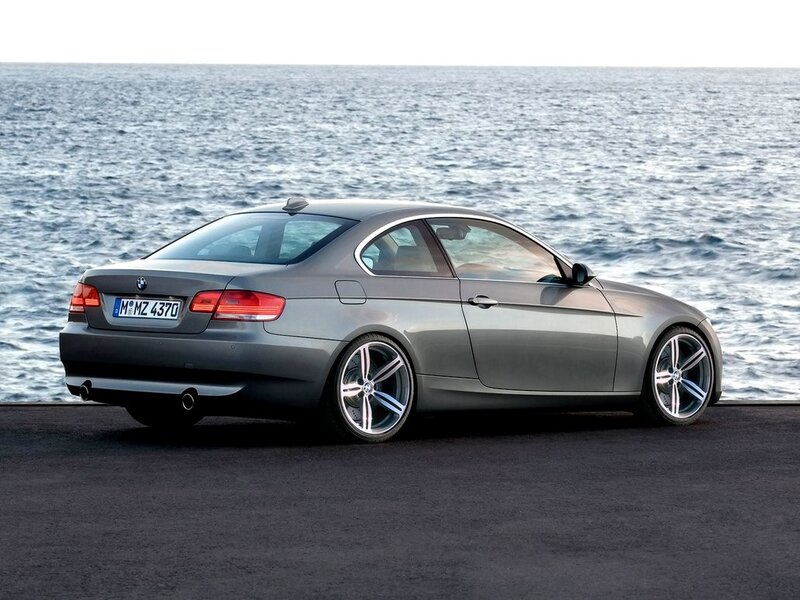 Gray BMW coupe by the sea