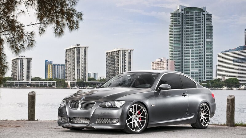 Gray BMW coupe by waterfront