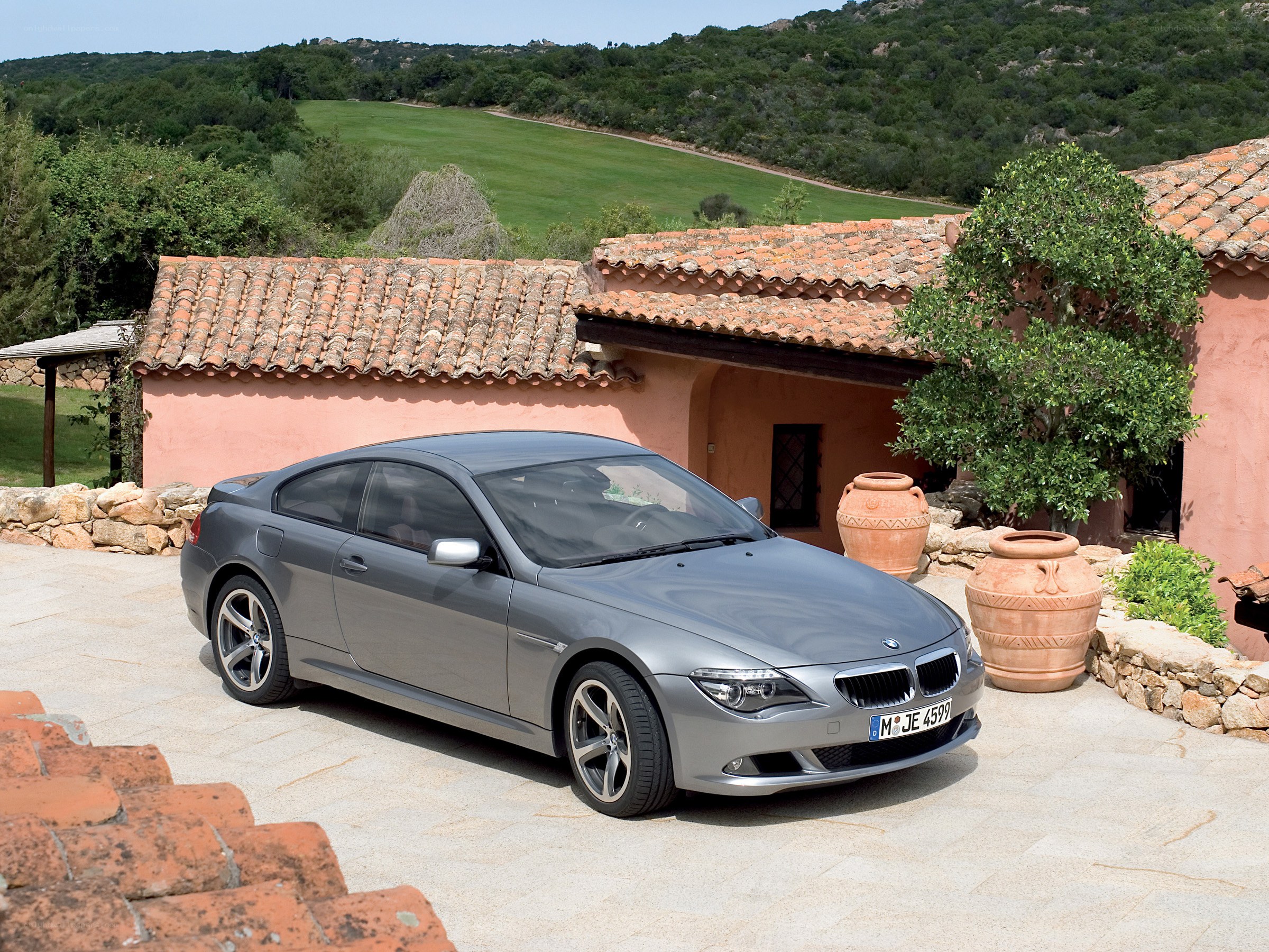 Gray BMW coupe in courtyard