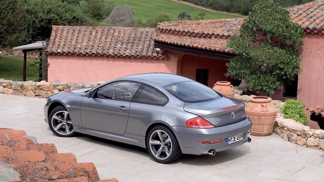 Gray BMW coupe in courtyard