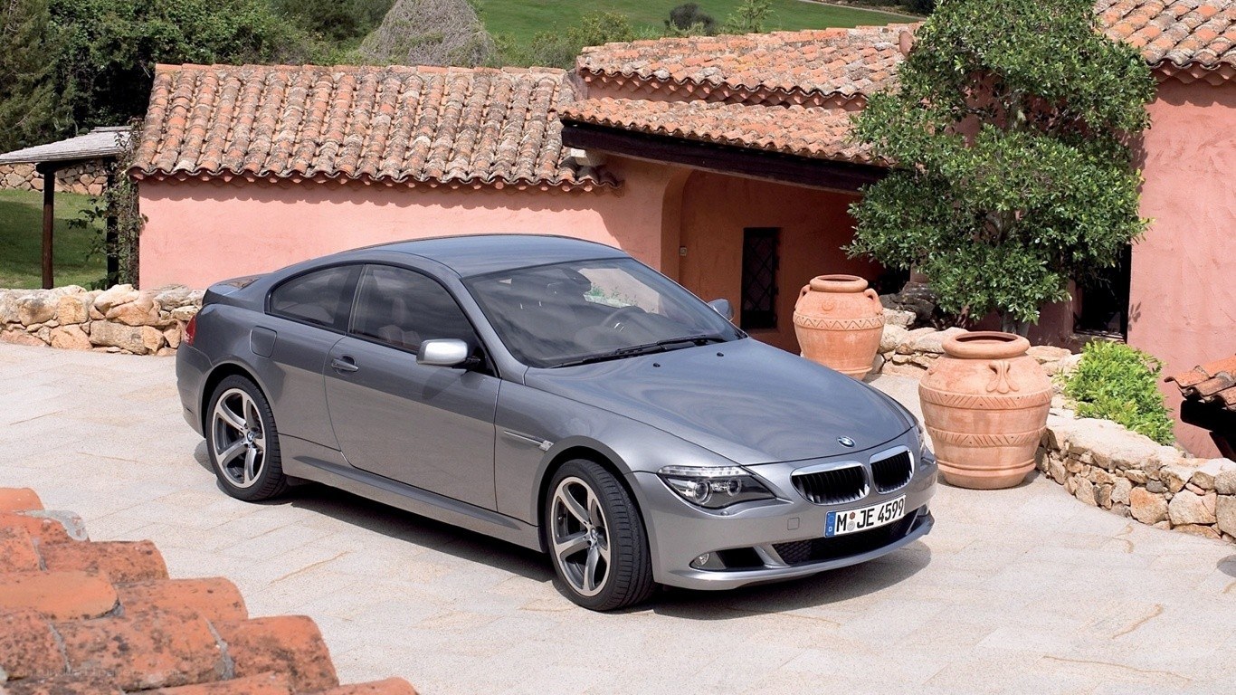 Gray BMW coupe in courtyard