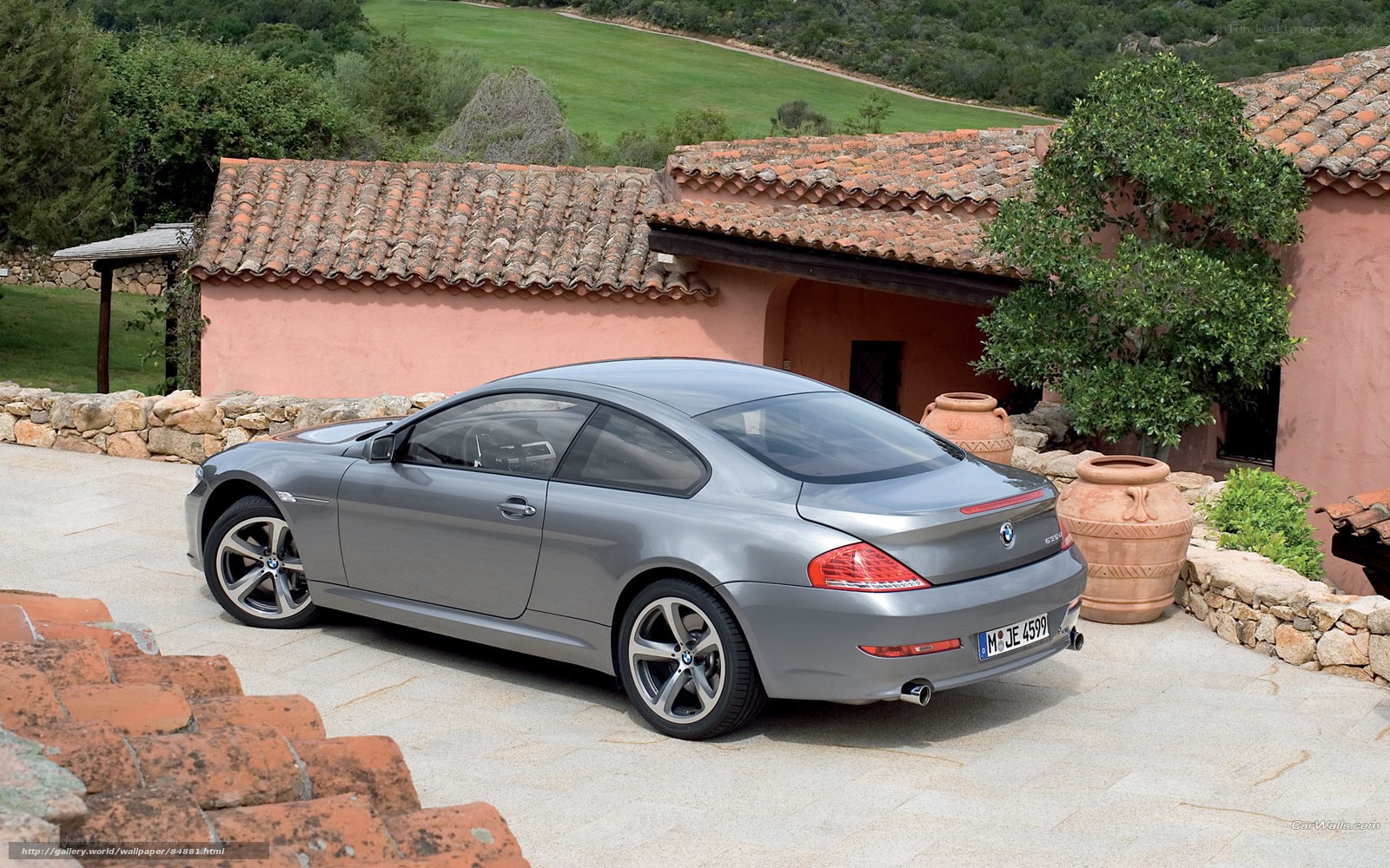 Gray BMW coupe in courtyard