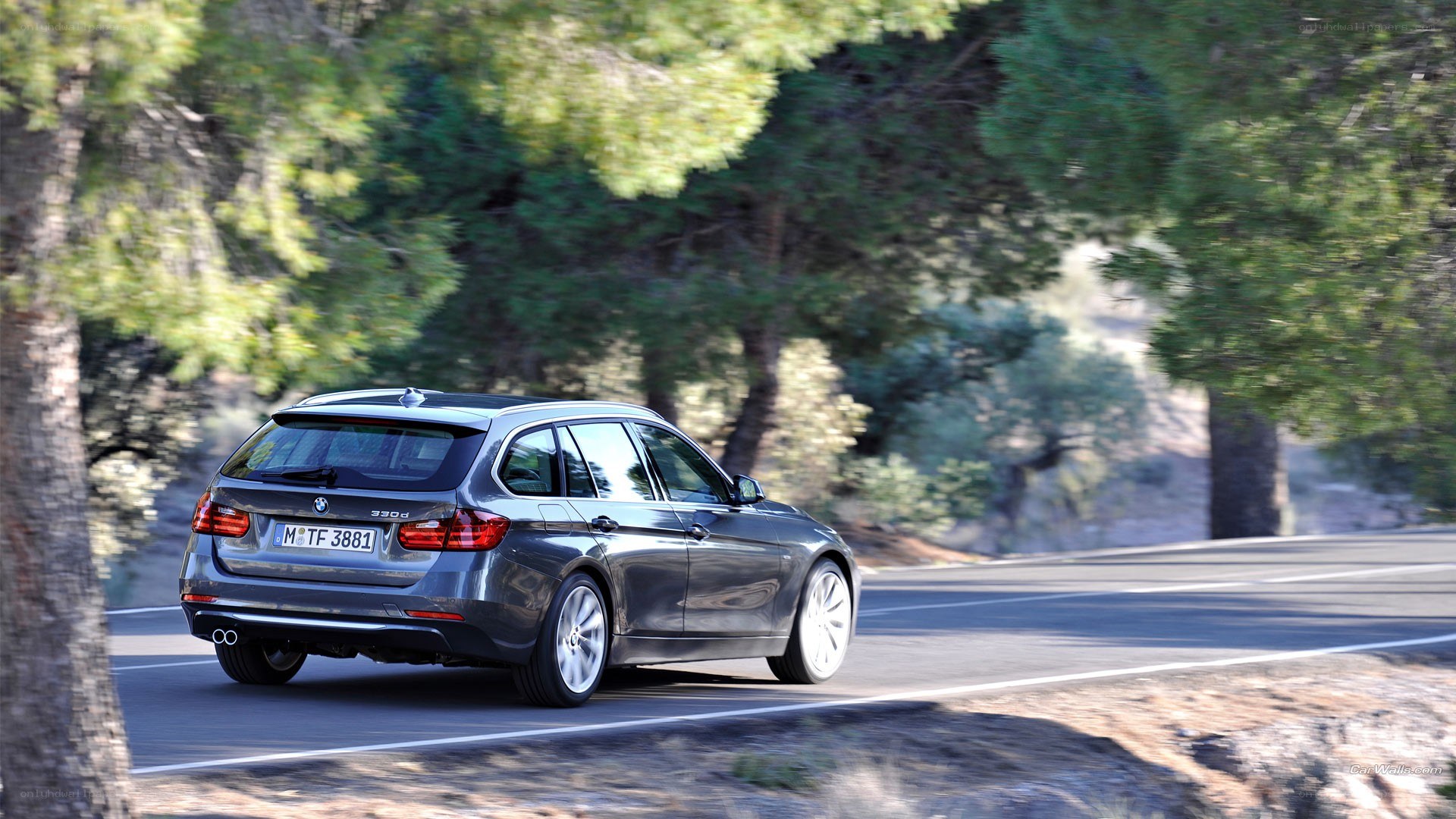 gray bmw driving on a road