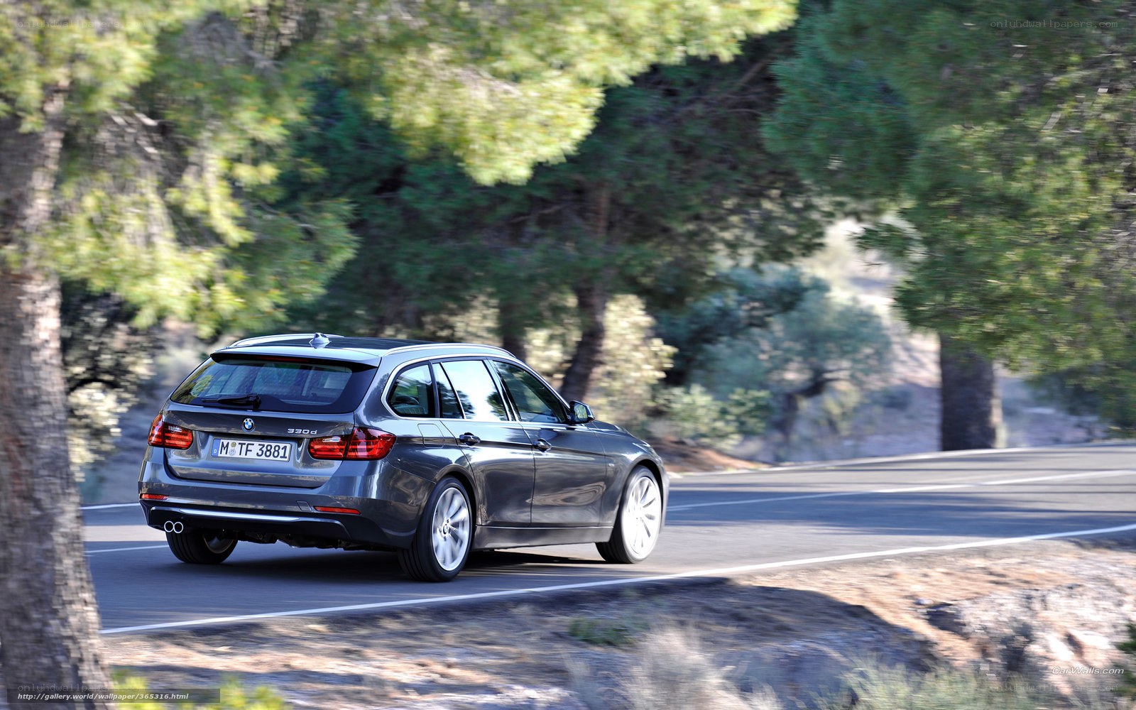gray bmw driving on a road