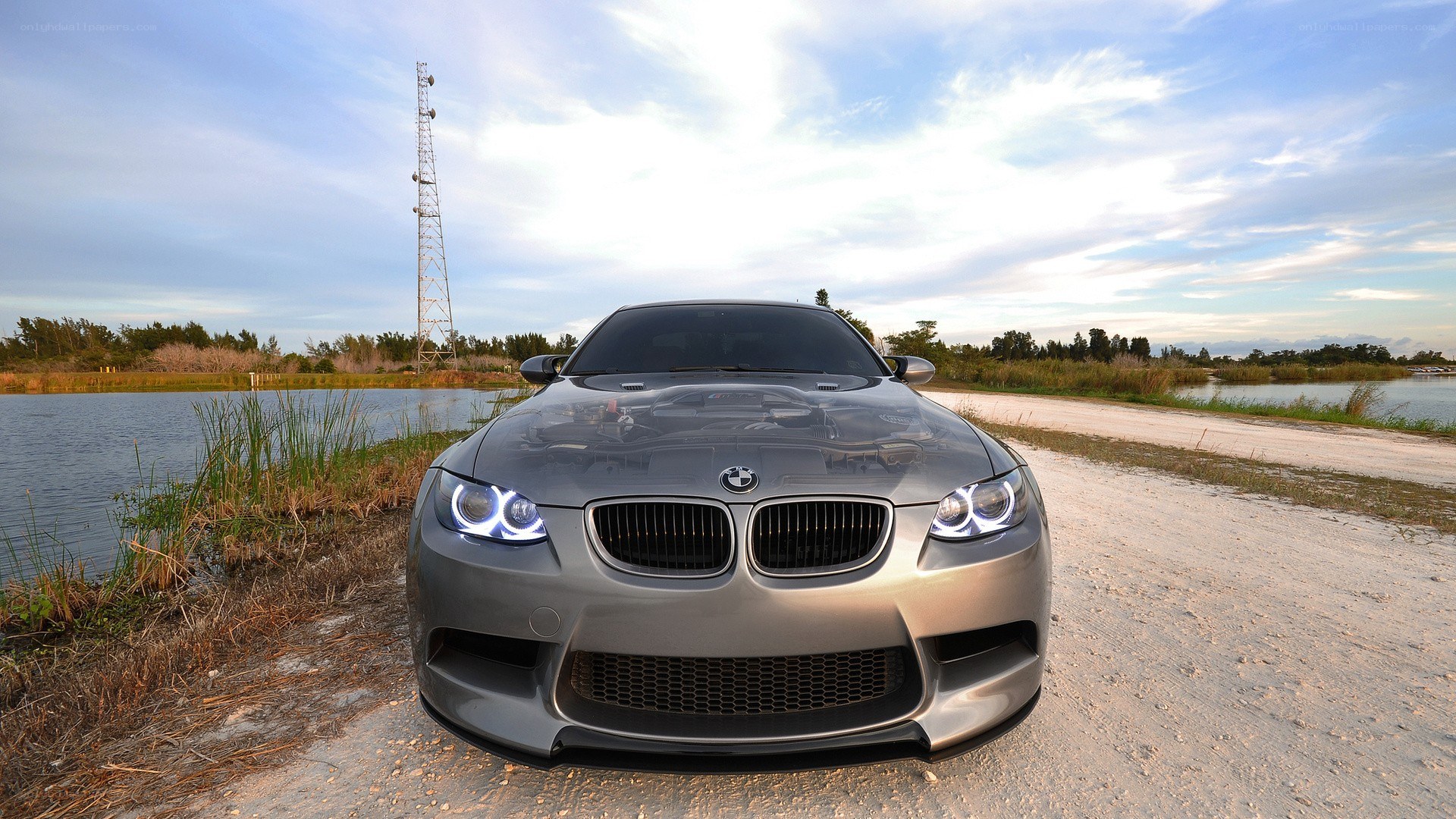 gray bmw m3 by a lake