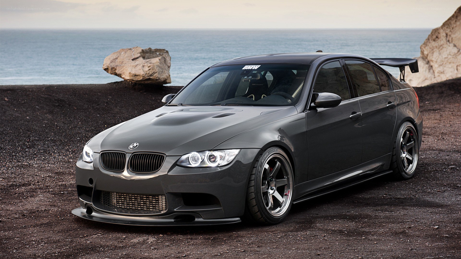 gray bmw m3 by the sea