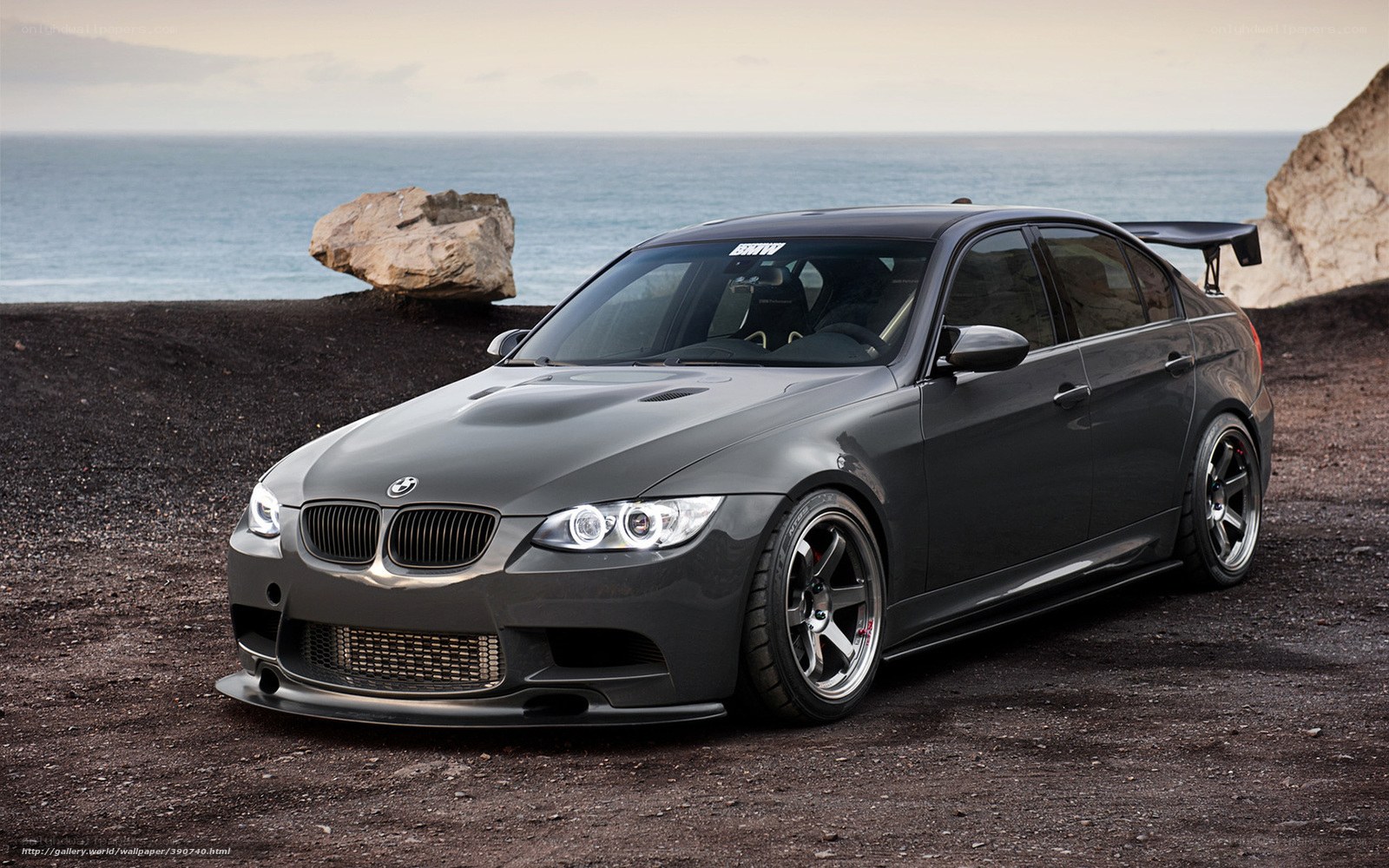 gray bmw m3 on beach