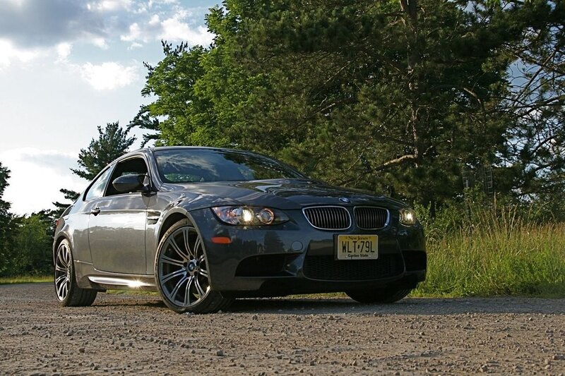 gray bmw m3 on gravel road