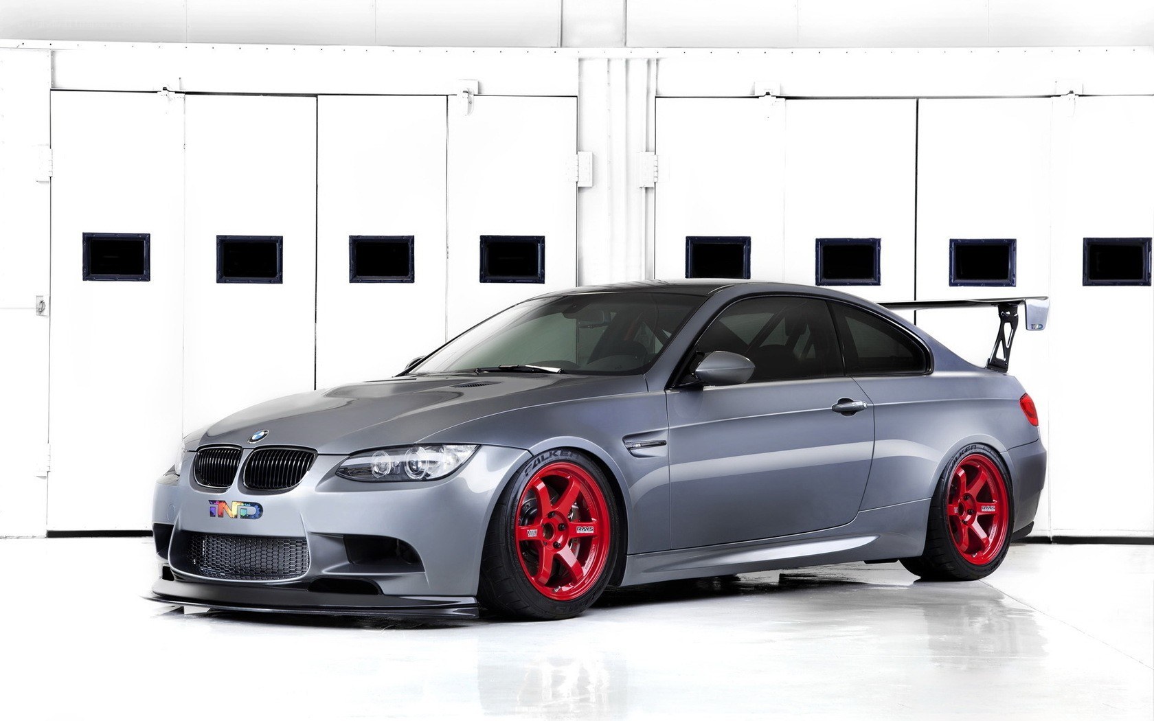 gray bmw m3 with red wheels