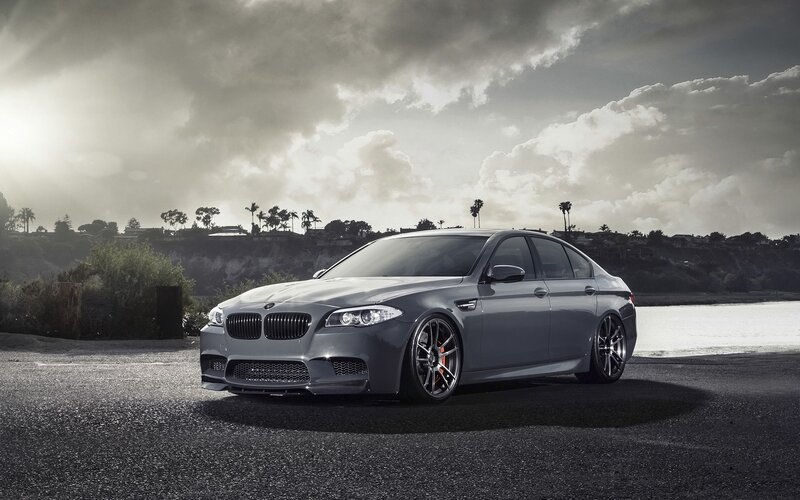 gray bmw m5 on coastal road