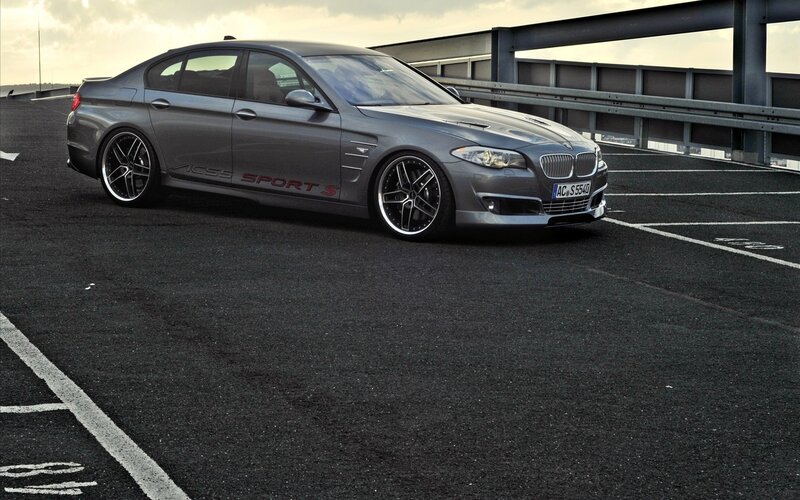 gray bmw sedan on parking deck
