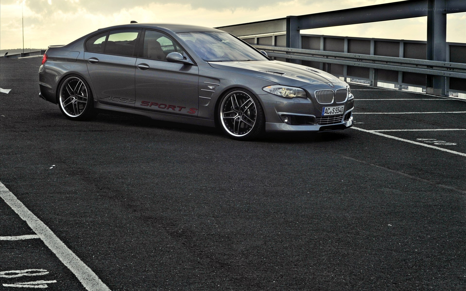 gray bmw sedan on parking deck