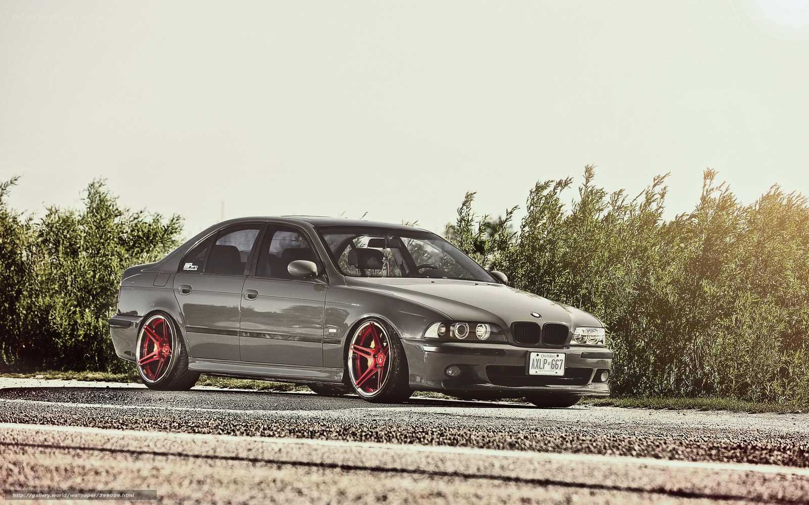 gray bmw sedan on road