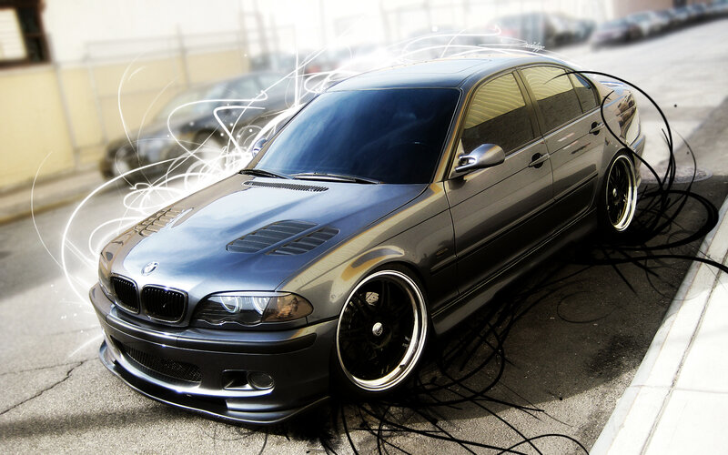 gray bmw sedan with custom wheels
