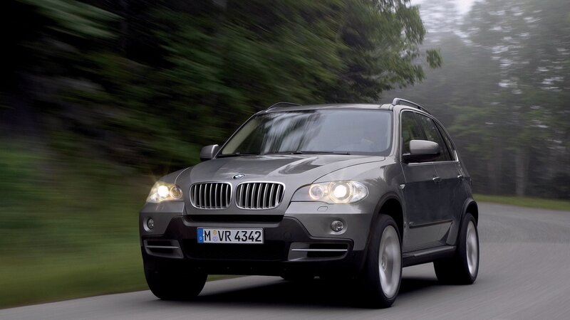 gray bmw suv on road