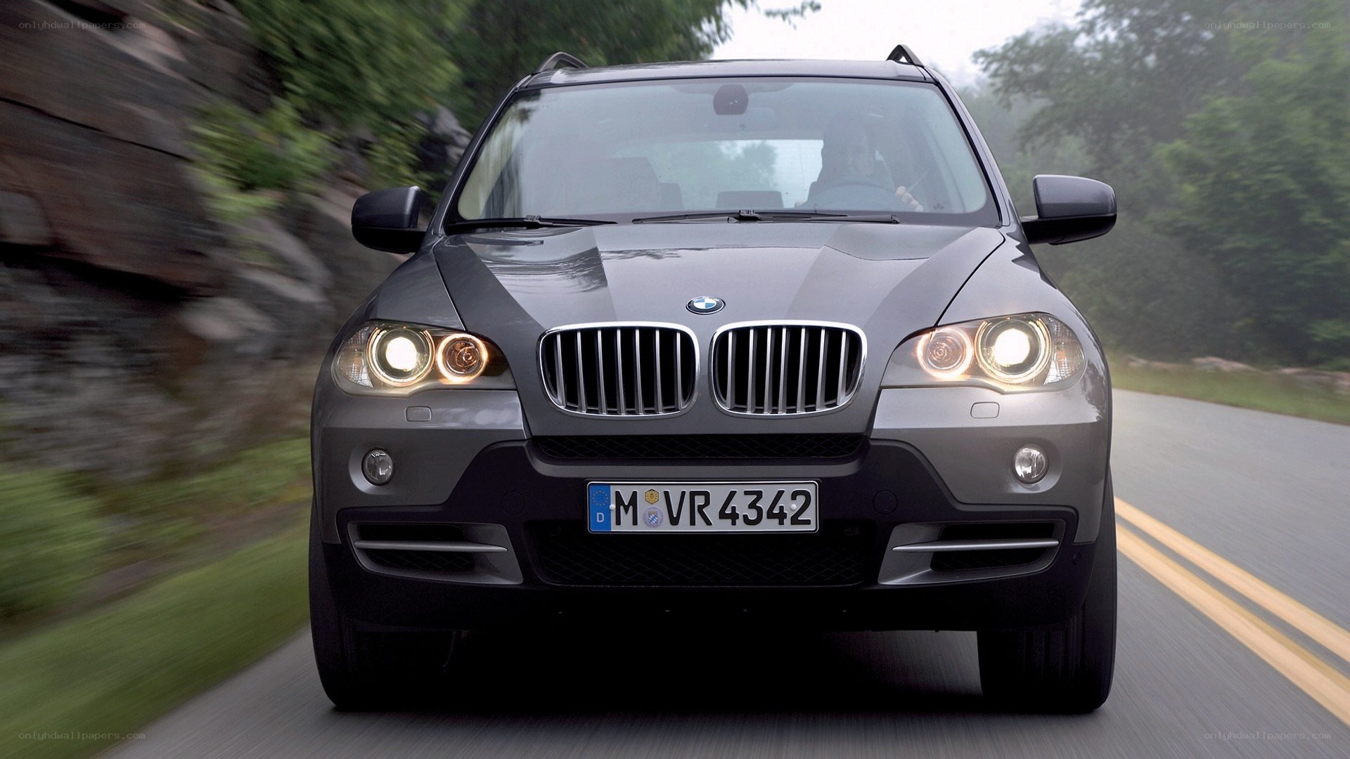 gray bmw suv on road