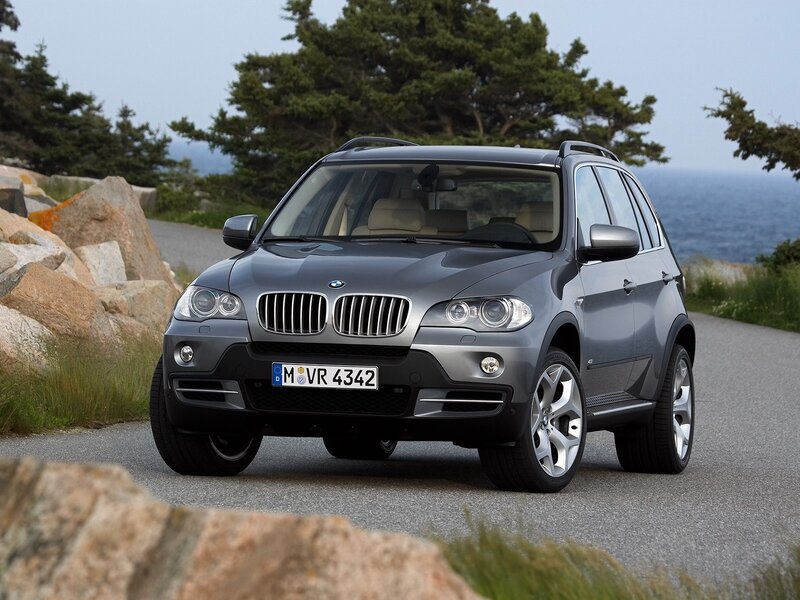 Gray BMW X5 on coastal road