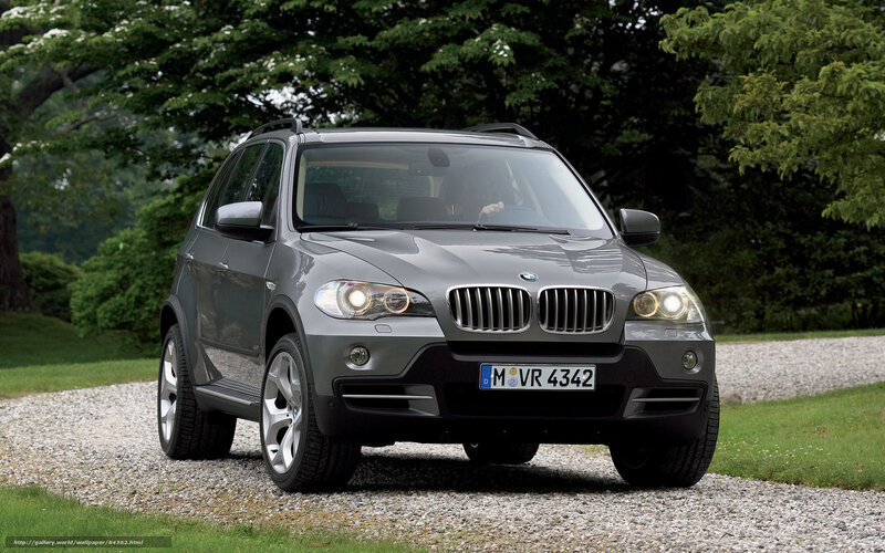 Gray BMW X5 on gravel path