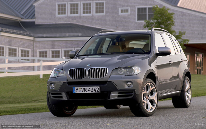 Gray BMW X5 parked on driveway