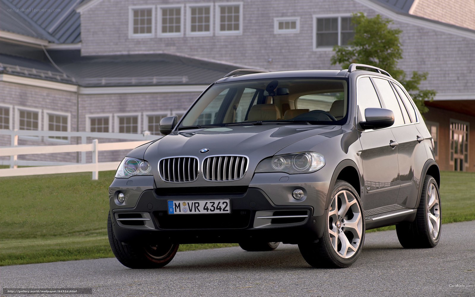 Gray BMW X5 parked on driveway