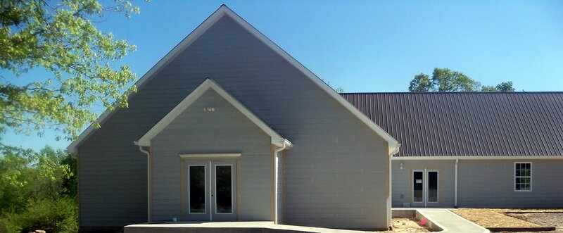 Gray Building with Metal Roof
