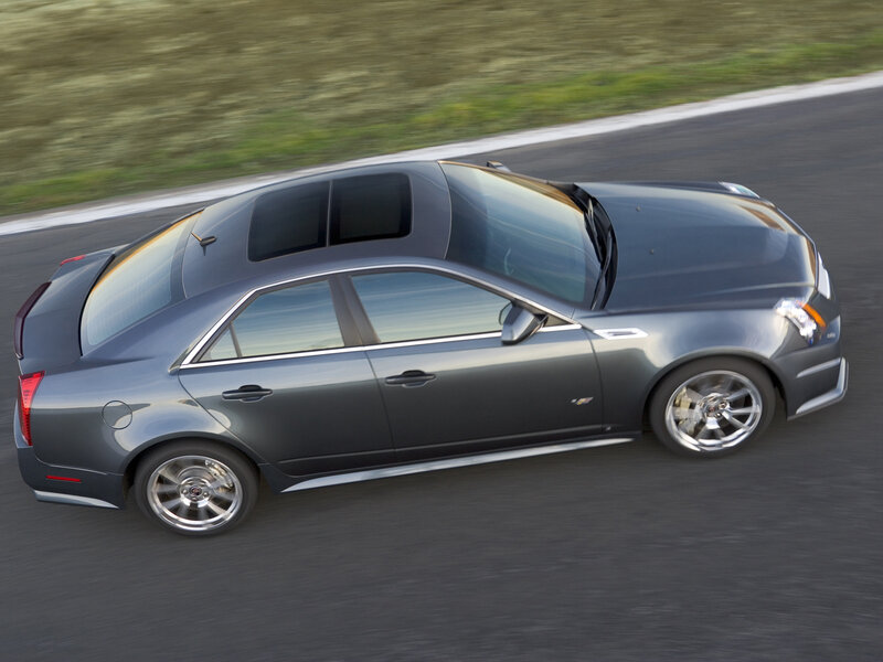 gray cadillac in motion