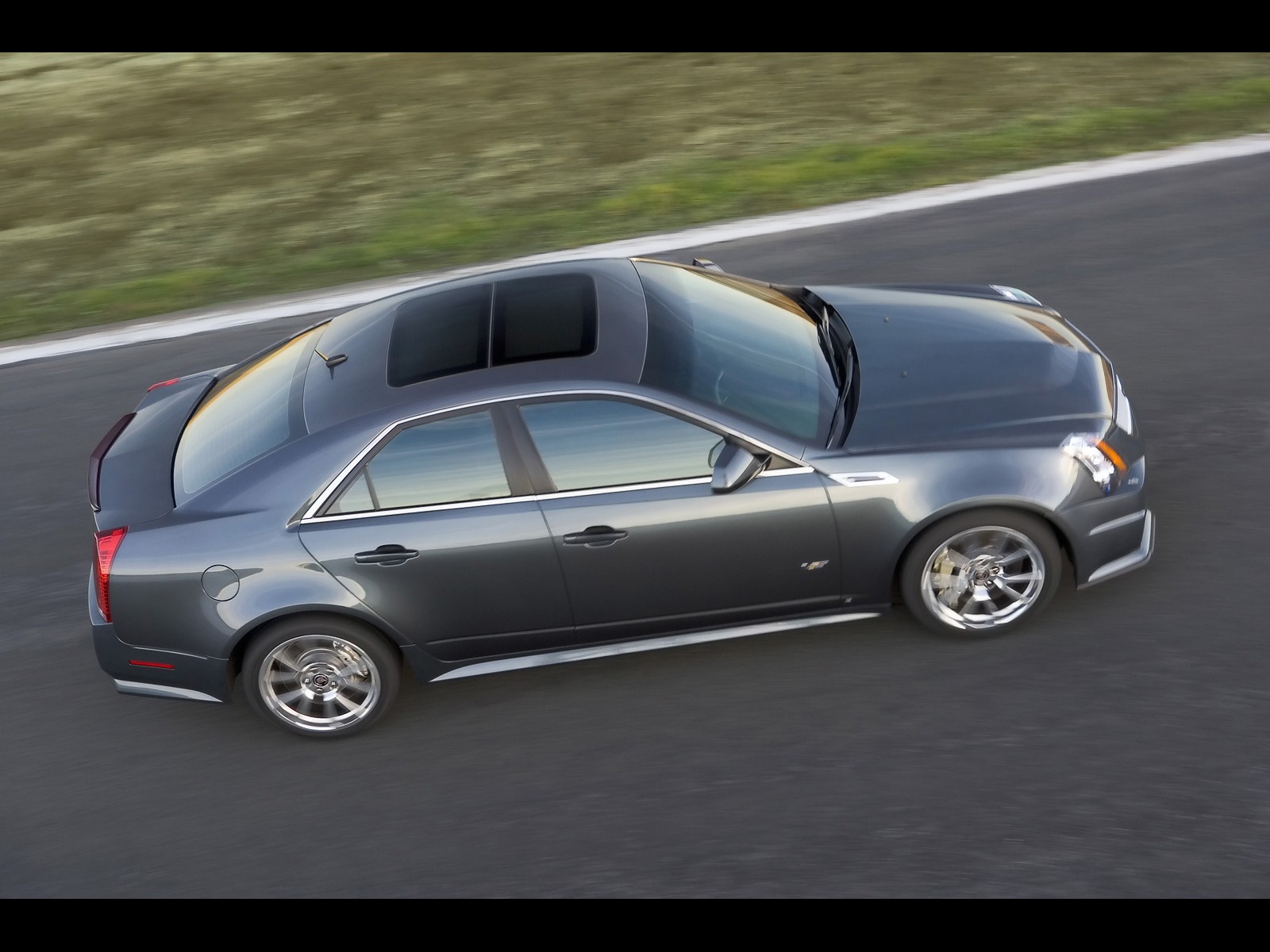 gray cadillac in motion