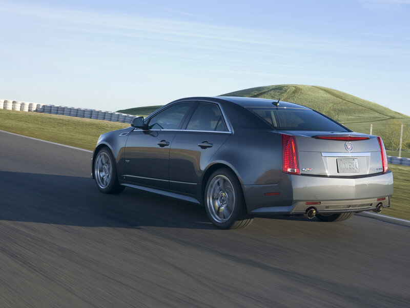 gray cadillac on a racetrack